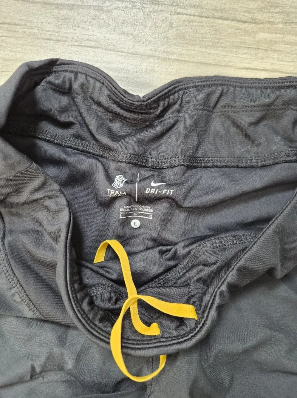 Nike Black Athletic Shorts with Yellow Accents and Steelers Patch